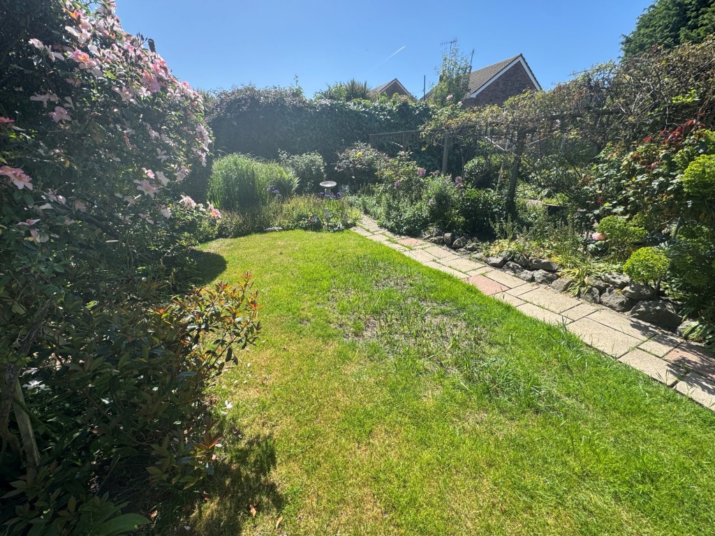 Lot: 94 - TWO-BEDROOM BUNGALOW WITH GARAGE AND PARKING - Rear garden - grass side